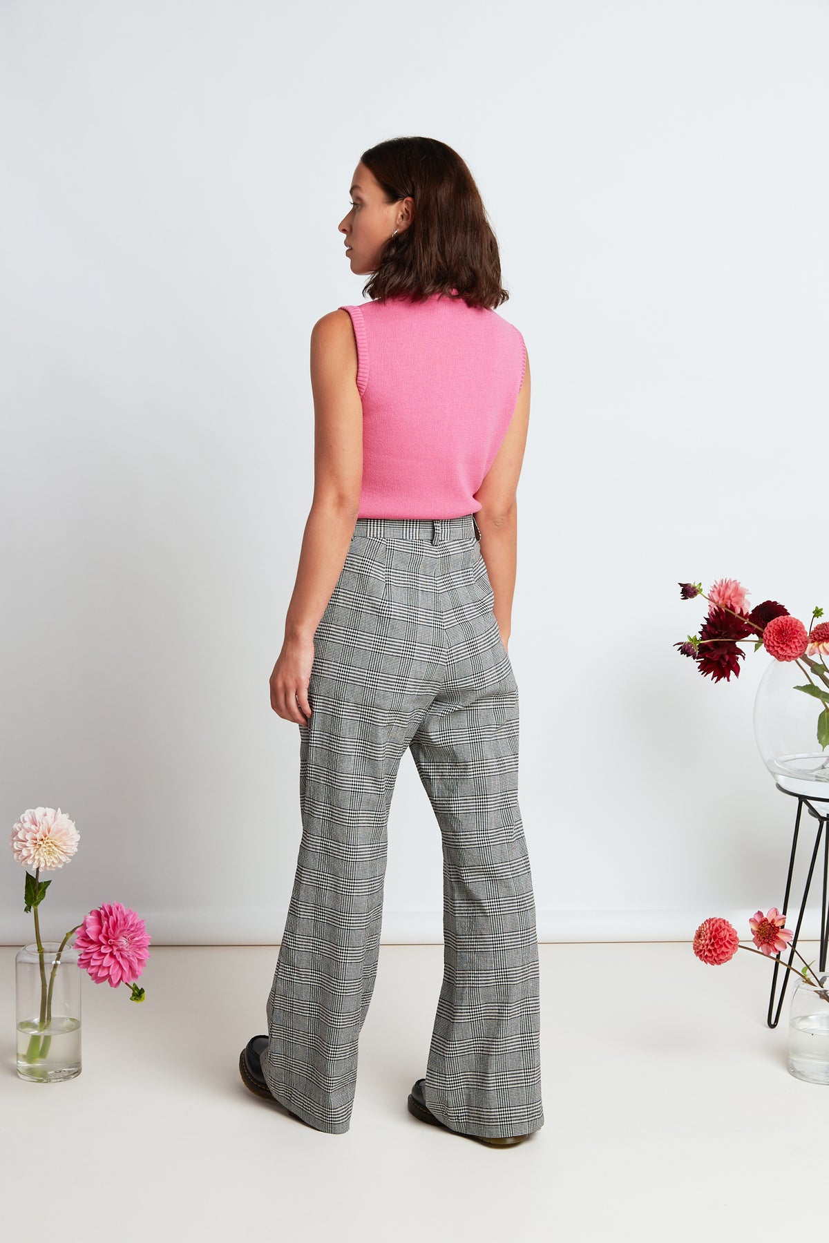 Davenport flares by twenty-seven names. High-waisted plaid pants with a flared leg, pockets and belt loops.