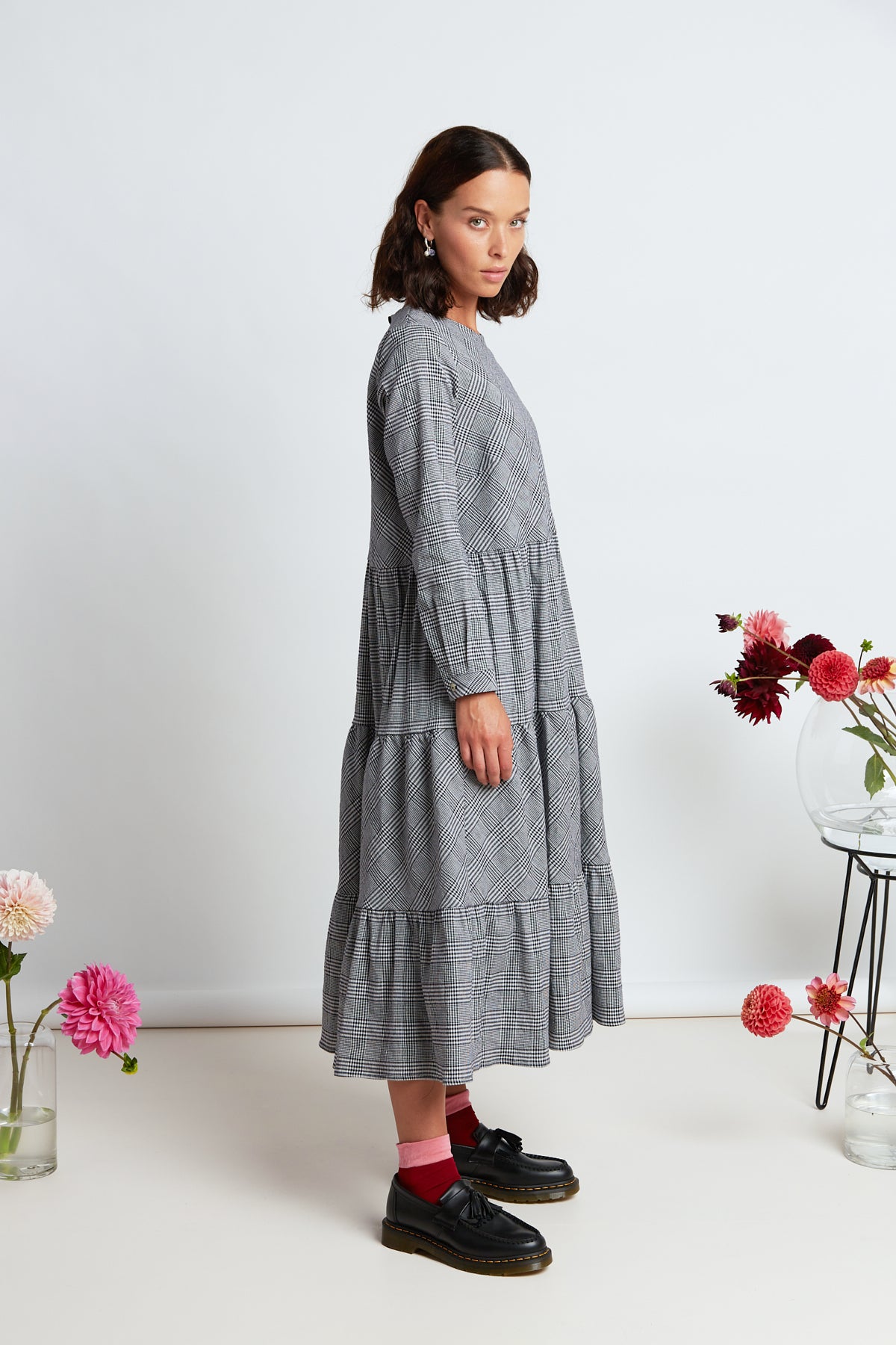 Boulevard dress by twenty-seven names. Long-sleeved plaid maxi dress with simple bodice, and gathered and tiered skirt.