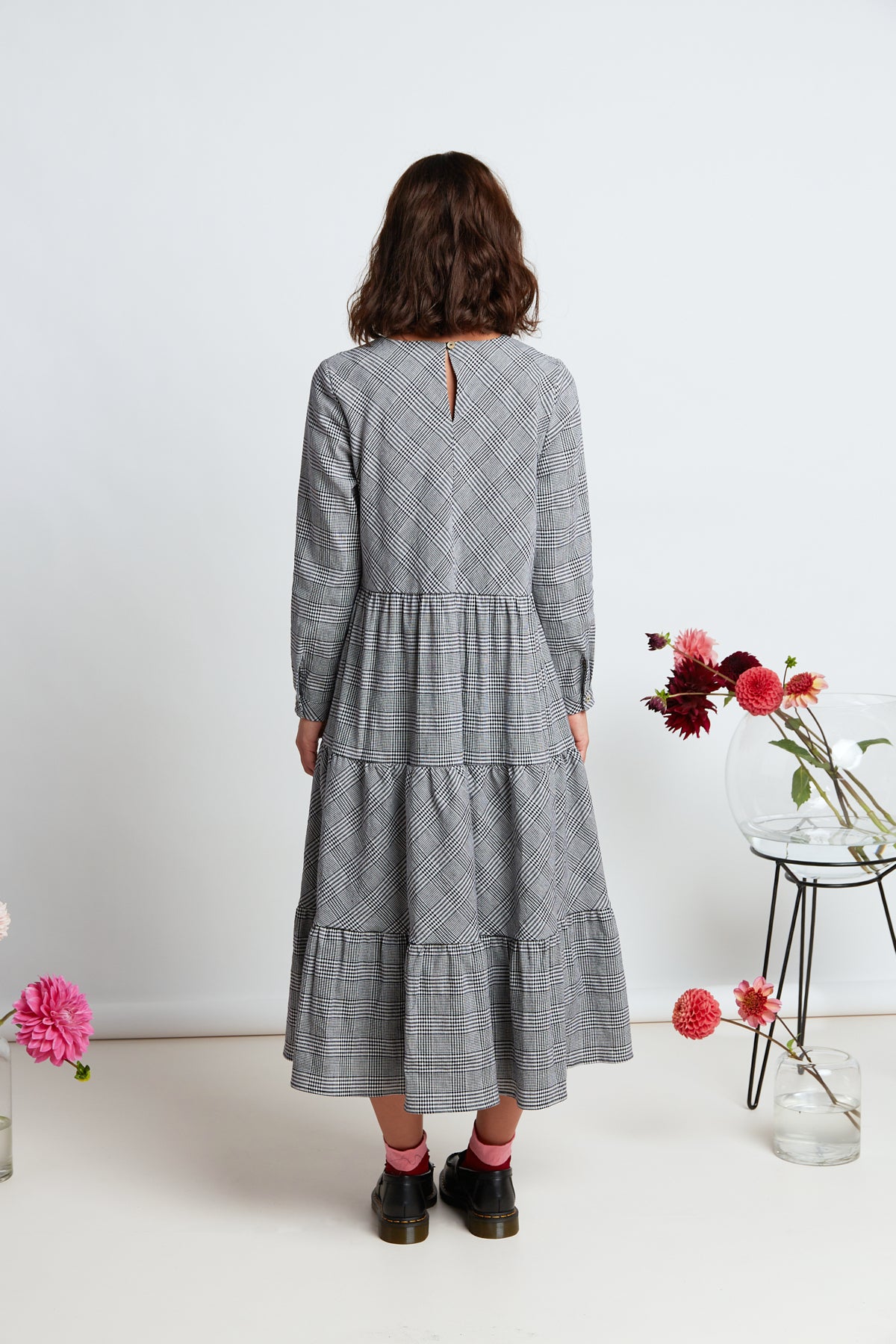 Boulevard dress by twenty-seven names. Long-sleeved plaid maxi dress with simple bodice, and gathered and tiered skirt.