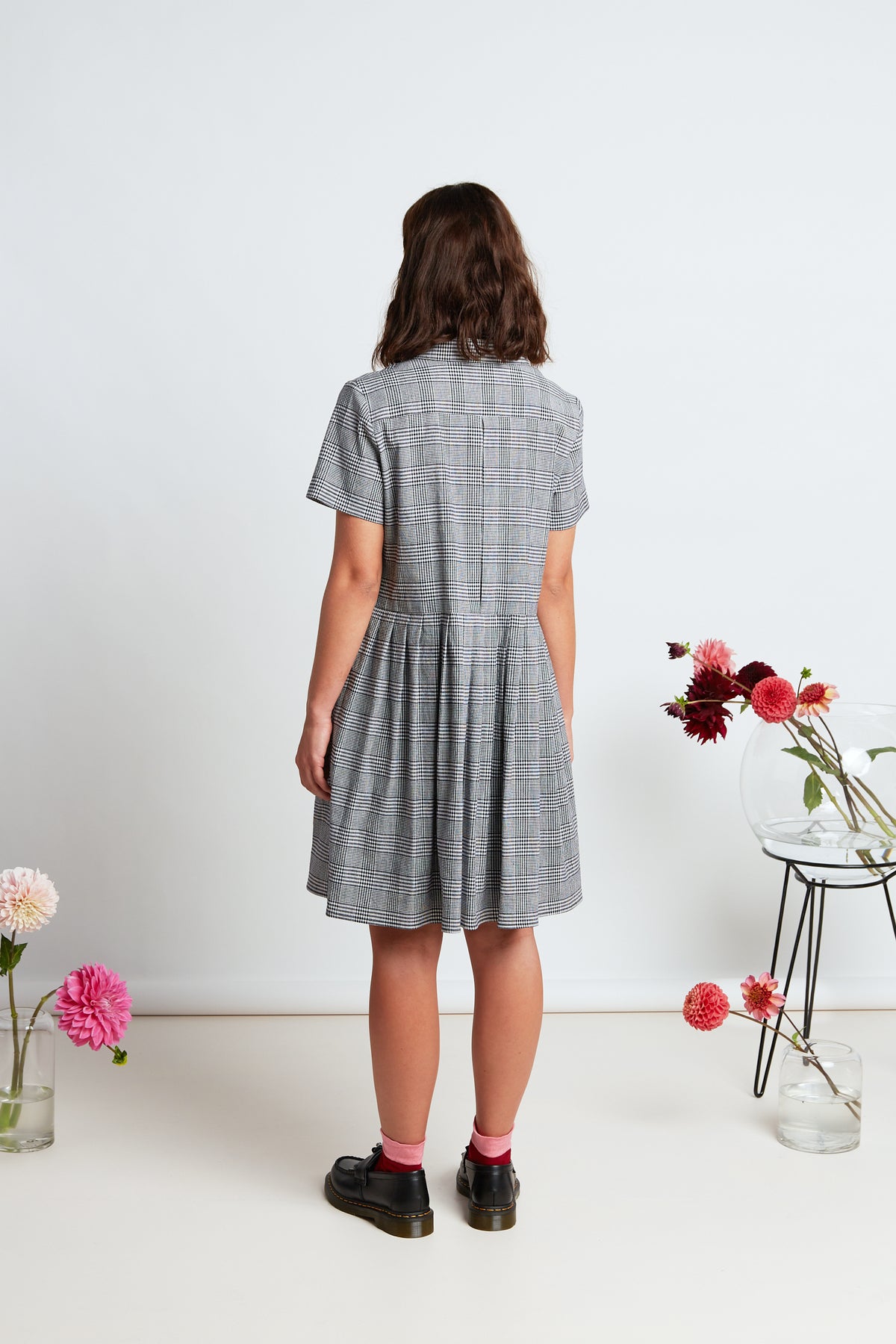 Melrose dress by twenty-seven names. A short sleeved, button front dress, with a curved blazer collar and short pleated skirt.