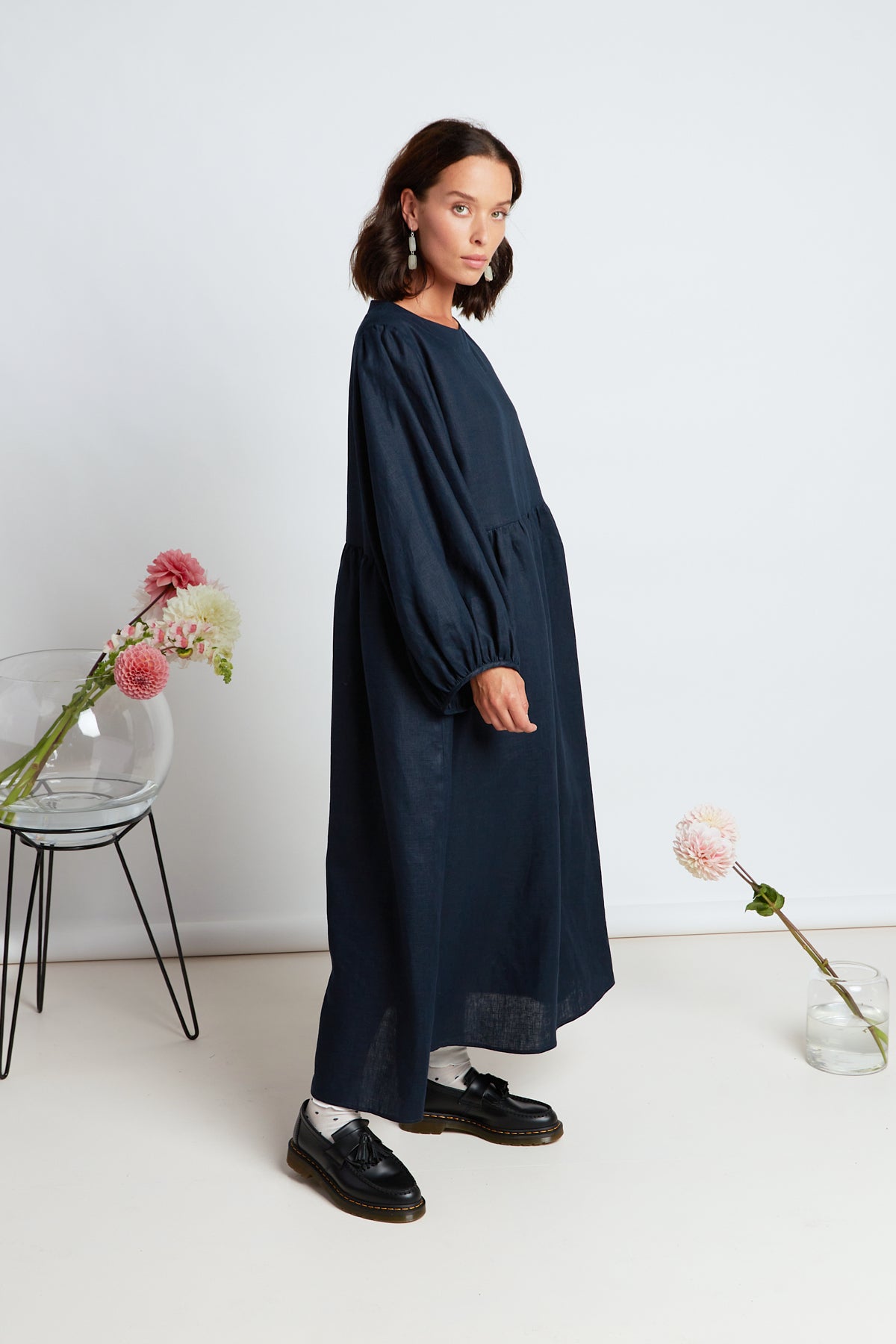 Lantana dress by twenty-seven names. An oversized maxi dress, with large, exaggerated, gathered sleeves, pockets and a long, gathered skirt.  Classic navy, 100% linen.