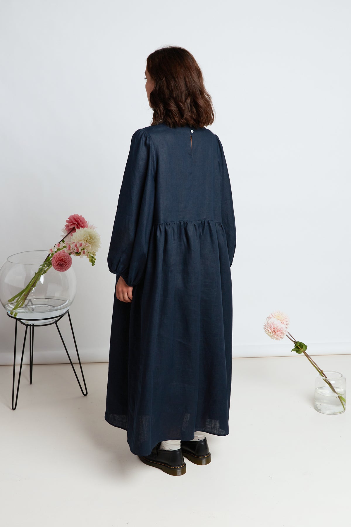 Lantana dress by twenty-seven names. An oversized maxi dress, with large, exaggerated, gathered sleeves, pockets and a long, gathered skirt.  Classic navy, 100% linen.