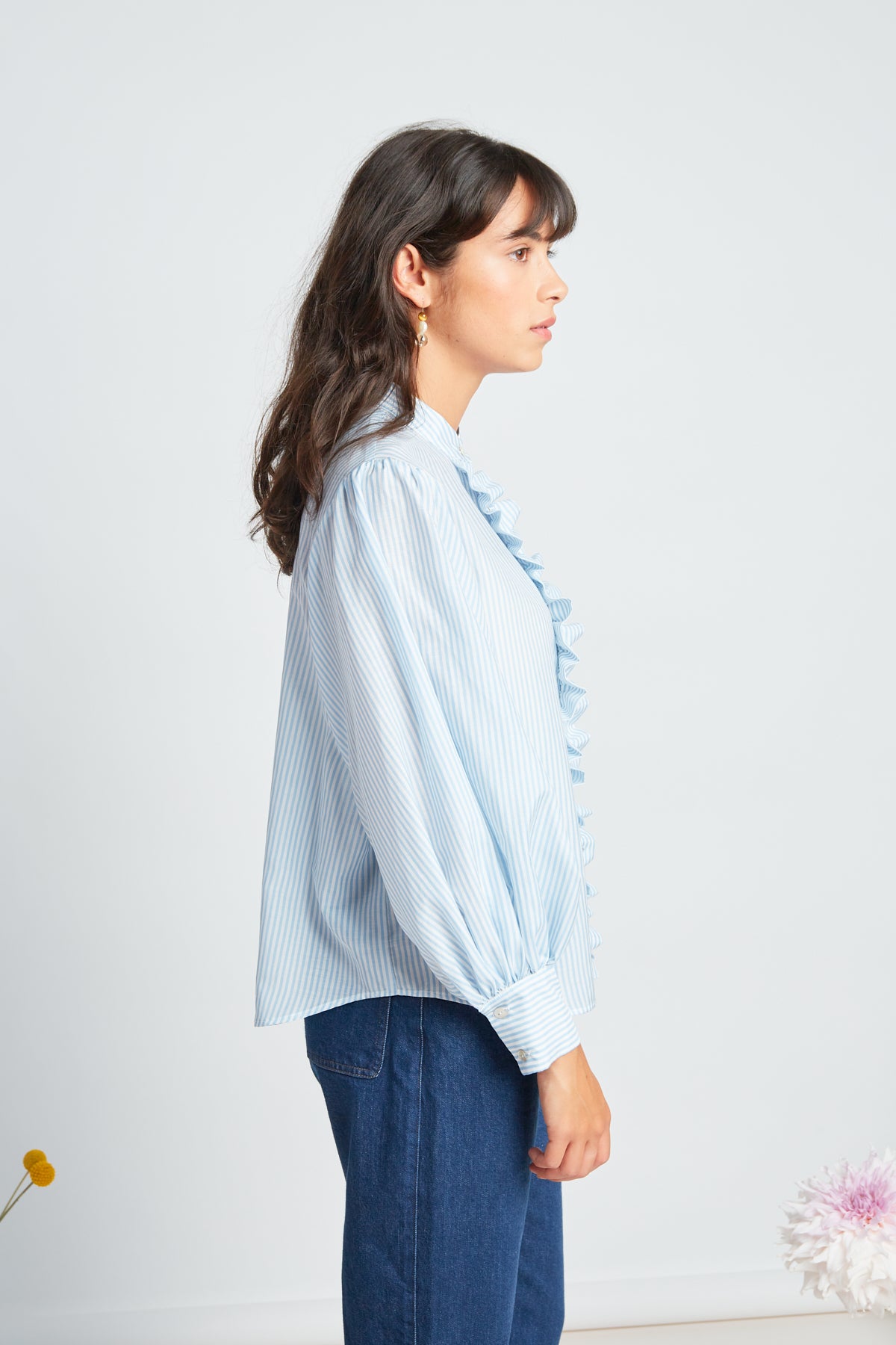 Forget-me-not blouse by twenty-seven names. Soft forget-me-not blue and white silk-cotton stripe blouse with long, exaggerated gathered sleeves, a frill down the front placket, and an optional big bow accessory.