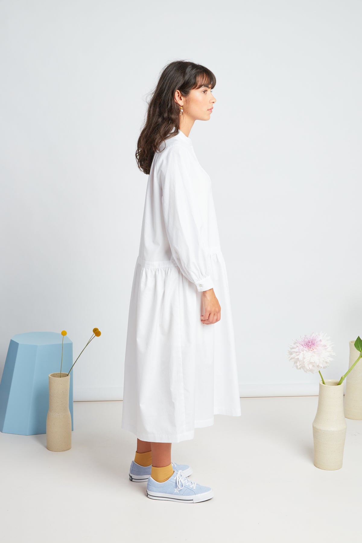 Sade dress by twenty-seven names. A crisp shirt dress in organic cotton, with half placket at the neck, and a dropped waist skirt. Pictured in white.