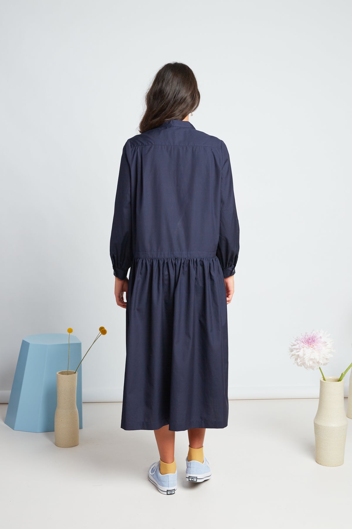 Sade dress by twenty-seven names. A crisp shirt dress in organic cotton, with half placket at the neck, and a dropped waist skirt. Pictured in navy.