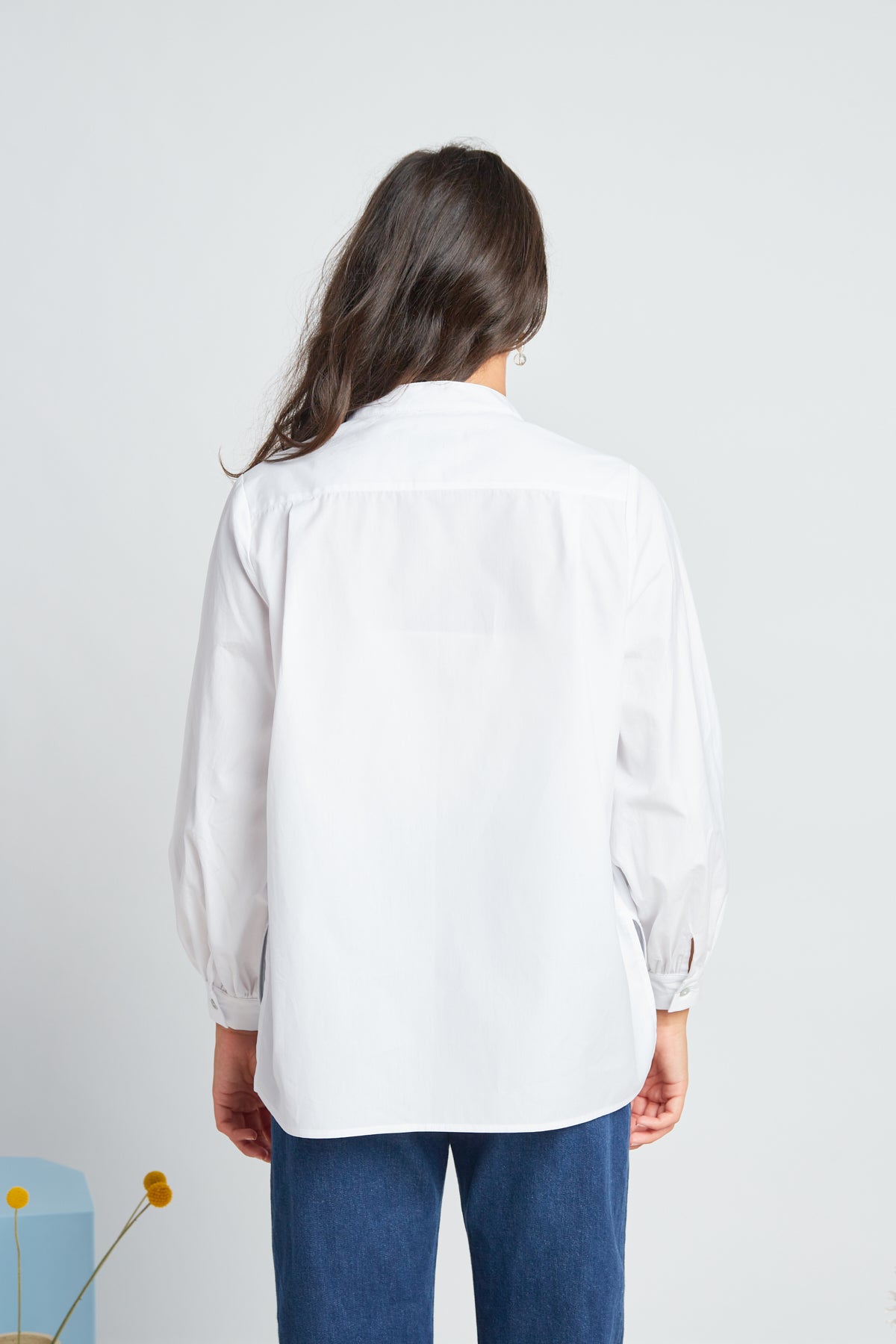 Promised shirt by twenty-seven names. A long-sleeved blouse in crisp organic cotton featuring a half placket at the neck and a dropped back bodice. Pictured in white.