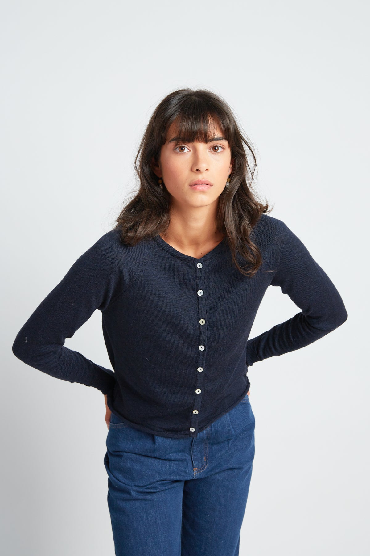 Daybreak cardigan by twenty-seven names. A chic little light-weight merino cardigan with raglan sleeves and shell buttons. Pictured in navy.