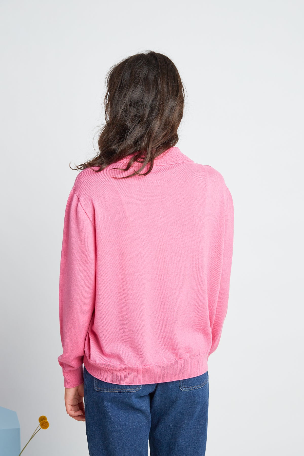 Katie jumper by twenty-seven names. A light-weight 100% merino sweater with a zip at the centre-front and a little collar. Pictured in Candy pink.